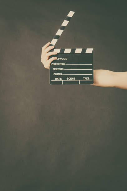 istock Woman holding professional film slate 689968352
