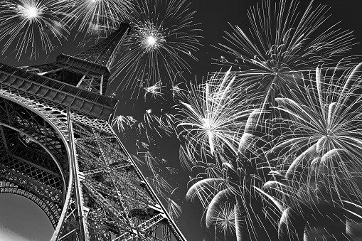 Eiffel tower at night with fireworks, french celebration and party, black and white image, Paris France