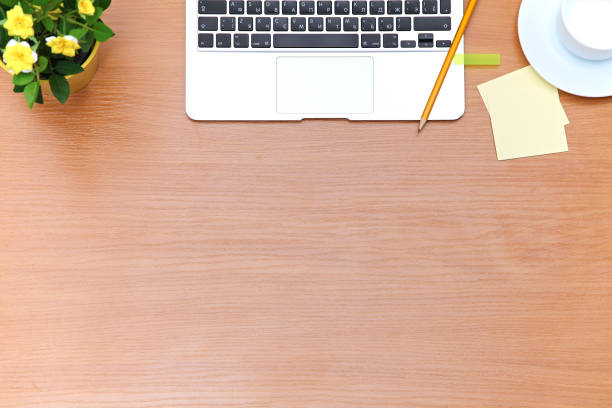 istock Office table with laptop, notepad and coffee cup. View from above with copy space 689971154