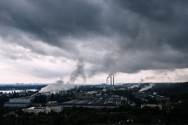 istock Smoke and dramatic sky after thunderstorm above industrial zone near town 689975976