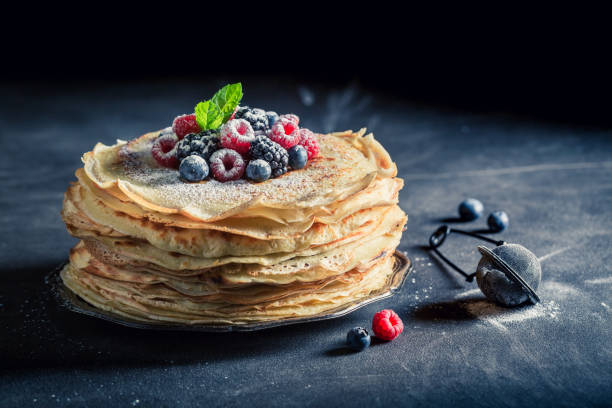 istock Homemade pancakes cake with fresh berries and mint 689976554