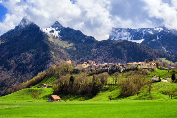 Gruyeres town, known for his world famous Gruyere cheese, laying on a hill in the Alps mountains, Switzerland
