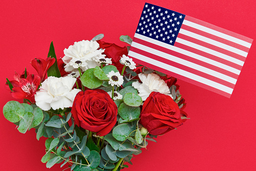 Beautiful bouquet with american flag on red background