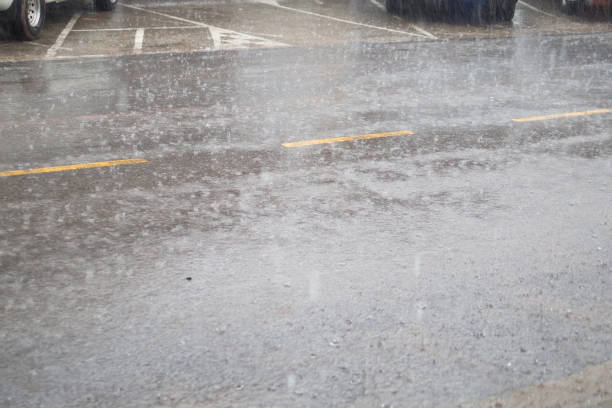 istock Raindrop on the local street road wet floor 689979840
