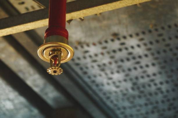 Automatic Fire Sprinkler in red water pipe System Automatic Fire Sprinkler in red water pipe System extinguishing photos stock pictures, royalty-free photos & images