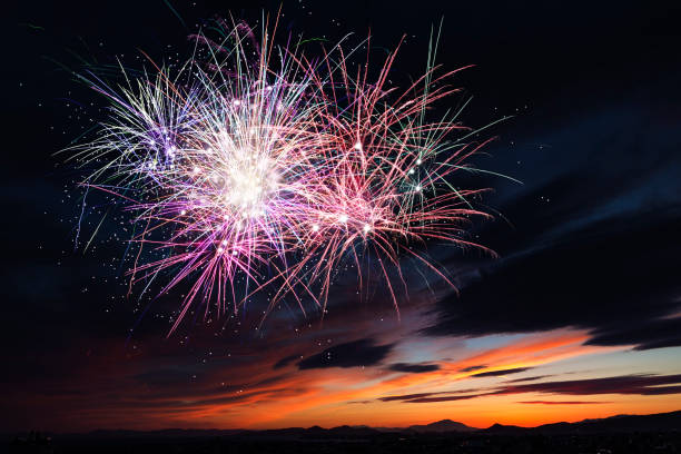 istock Beautiful colorful holiday fireworks in the evening sky 689982796