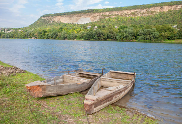istock two wooden boats on the shore 689983222