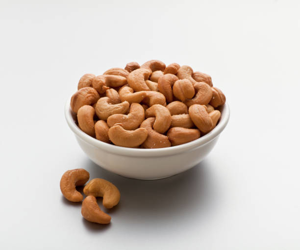 Roasted and salted cashew on white background