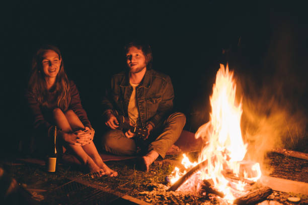 istock Friends have picnic in the forest at night 689983858
