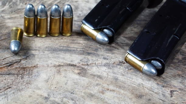 istock Bullets and a firearm on the wood 689987588