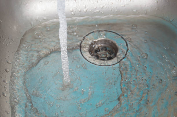 istock the sink pours water flow 689989812