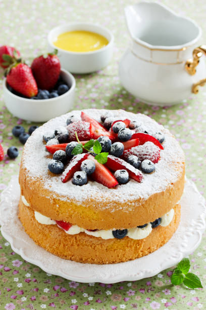 istock Genoise (cake) with cream, berries and lemon cream. 689993752