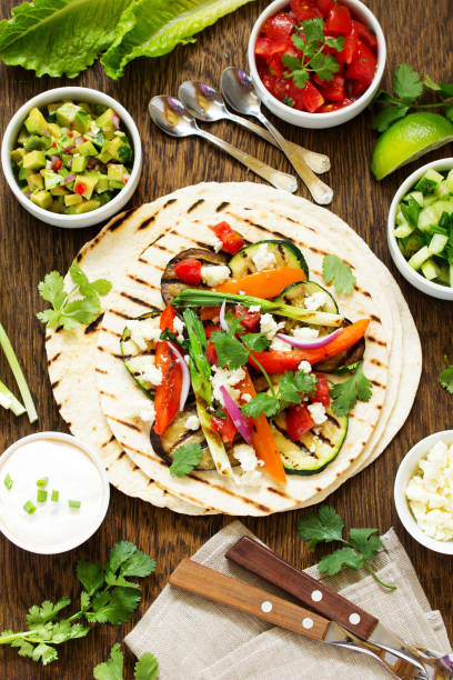 istock Vegetarian snack tacos with grilled vegetables and salsa. 689994632
