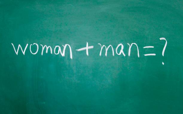 istock women and men sign drawn with chalk on blackboard 689997738