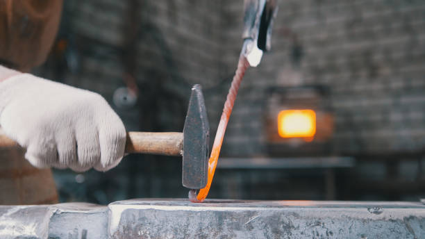 istock Hammer on the anvil, metal work, close up 689998488
