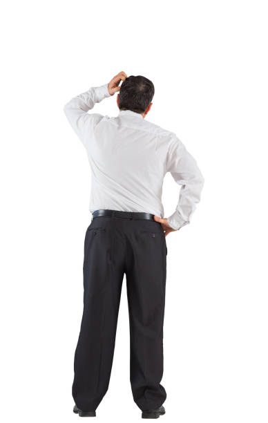 istock Mature businessman standing scratching head 690001688
