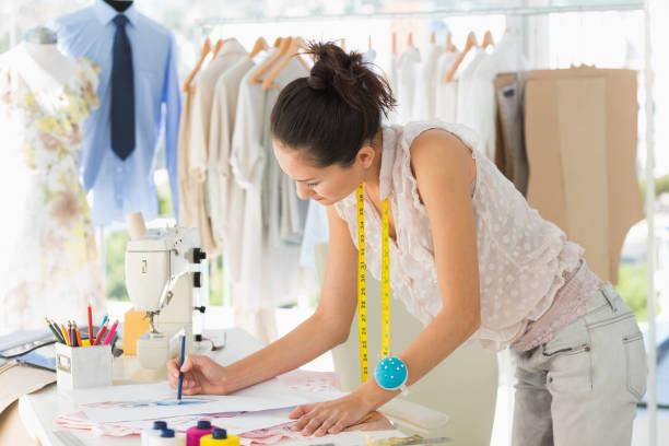 istock Female fashion designer working on her designs 690002070