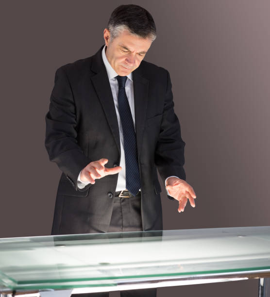 istock Concentrating businessman looking at desk 690002210
