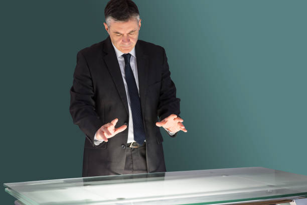 istock Concentrating businessman looking at desk 690002242