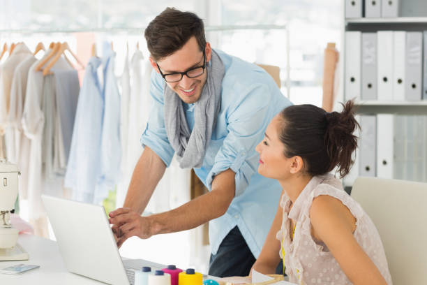 istock Fashion designers using laptop in studio 690002476