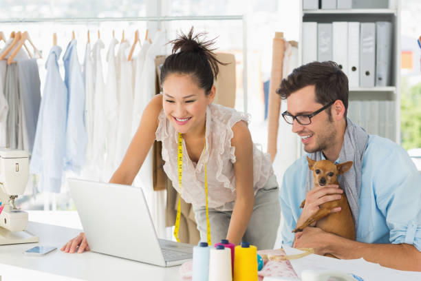 istock Fashion designers using laptop in studio 690002500