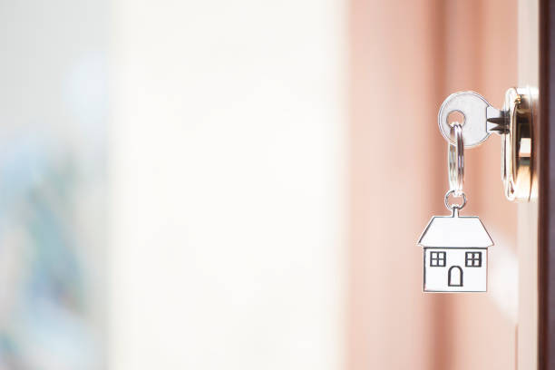 istock House key in the door 690005592