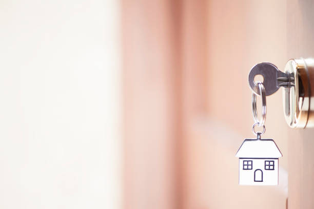 istock House key in the door 690005654