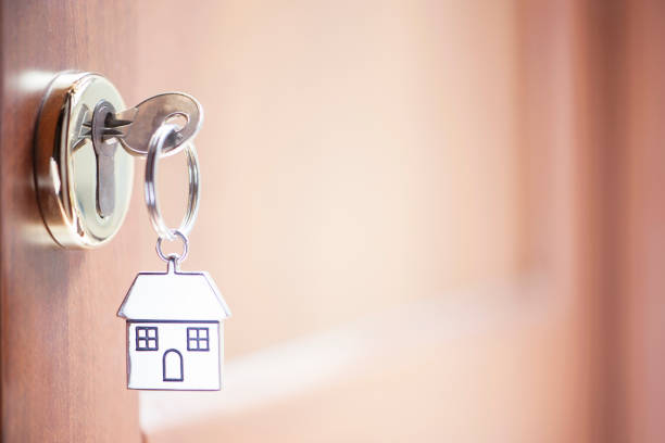 istock House key in the door 690005760