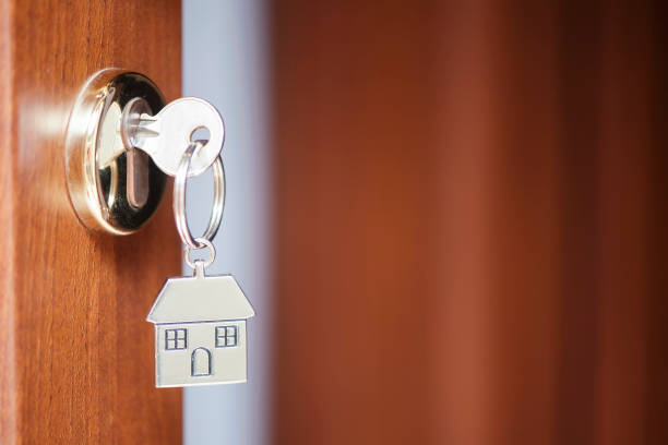 istock House key in the door 690005892