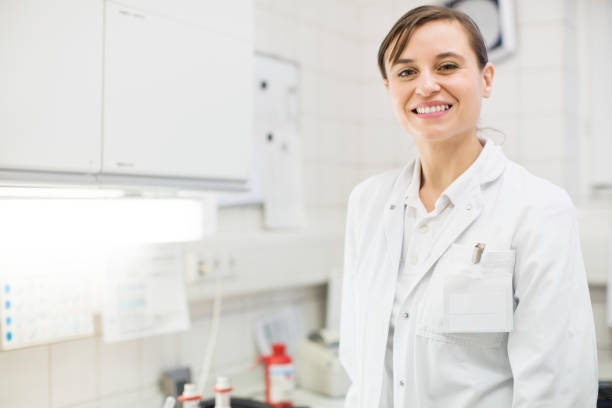 istock Smiling young female scientist at laboratory 690008524