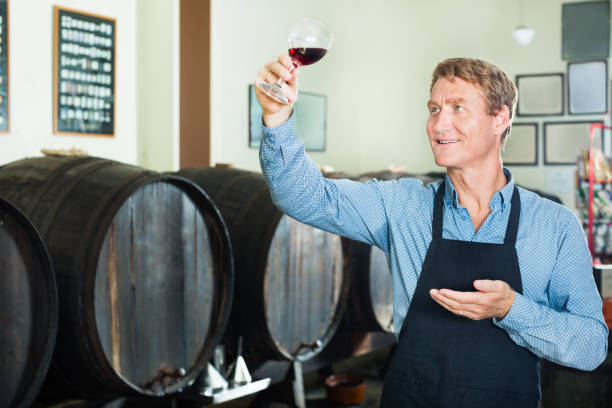 istock Seller promoting to taste wine 690009066
