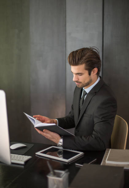 Lawyer preparing for a case in office. stock photo