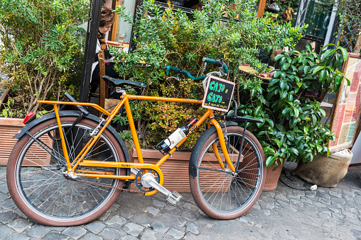Rome: Advertisement of a bar restaurant on a bicycle on a street in the historical center of Rome, Italy