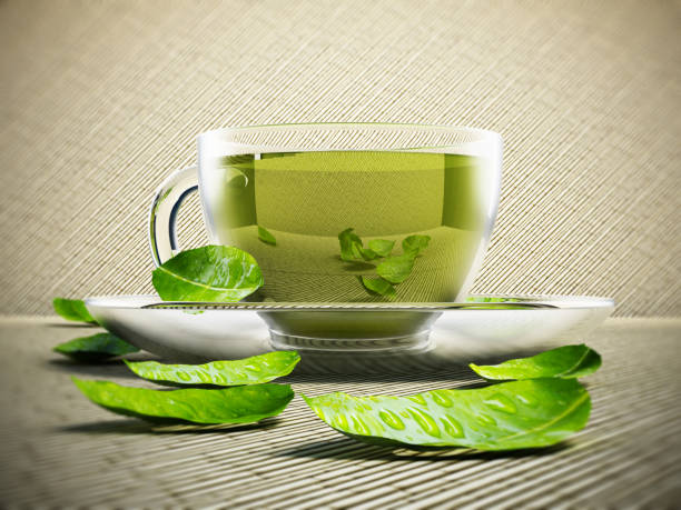 istock Glass cups with green tea and tea leaves isolated on white 690017232