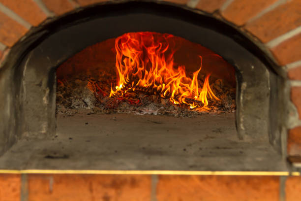 istock The fire burns in a wood pizza oven 690021552