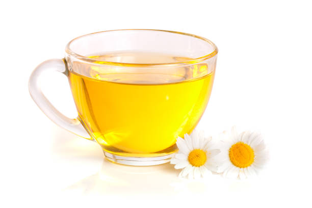 istock Herbal tea with fresh chamomile flowers isolated on white background 690021904