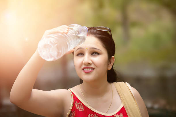 istock Young woman drinking water. 690022068