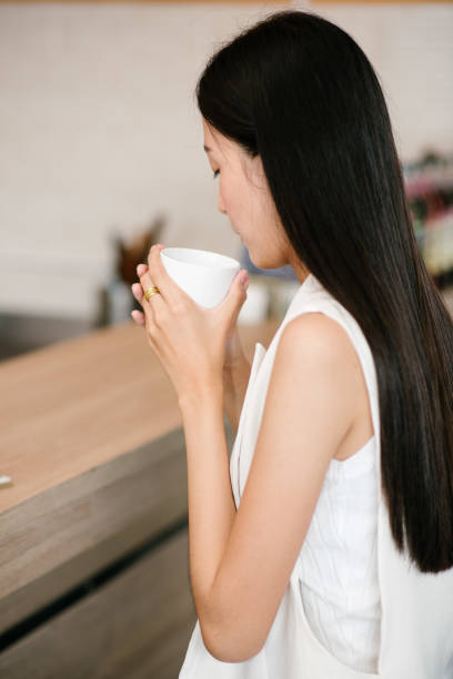 istock Young women drinking coffee at a cafe 690027810