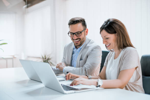 istock Two entrepreneurs sitting together working in an office 690028746