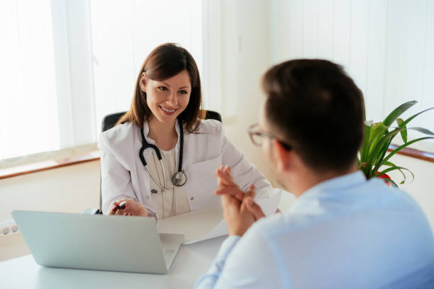 istock Doctor talking to patient in office 690029008