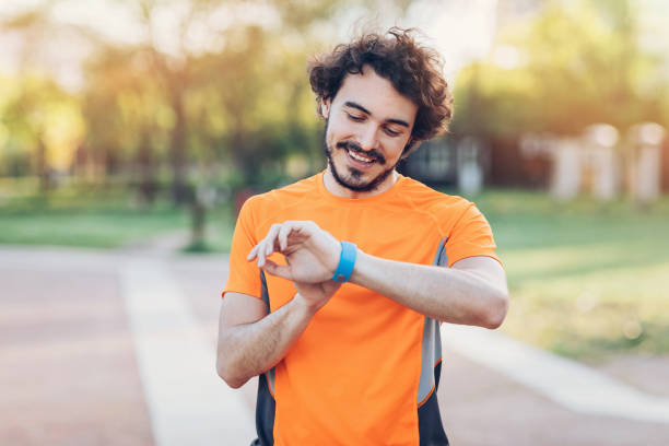 istock Athlete looking at his smart watch 690029732