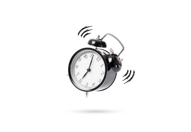istock black alarm clock isolated on white table background. concept wake up. 690032170