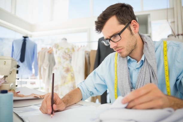 istock Fashion designer working on his designs 690039622