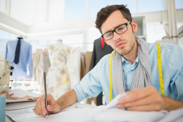 istock Fashion designer working on his designs 690039648