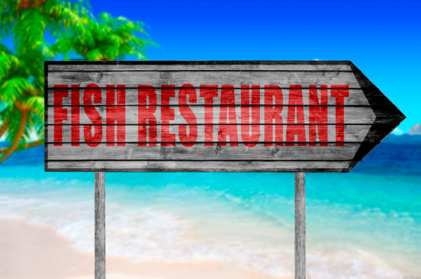 istock Red Fish Restaurant wooden sign isolated 690040108
