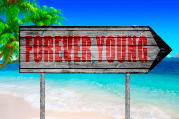 istock Red Forever Young sign isolated on white 690040244