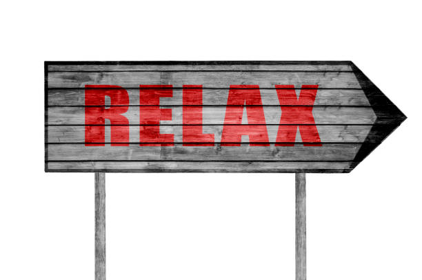 istock Red Relax wooden sign isolated on white 690046876