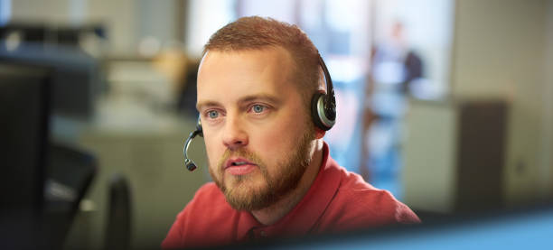 istock male customer service representative talking to customer 690054368