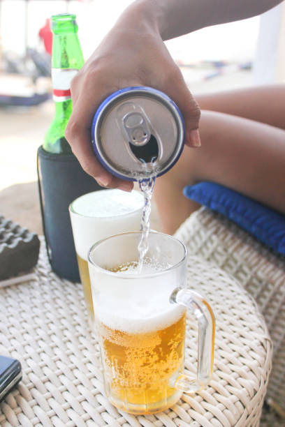istock Young female pouring sprite to beer 690057026