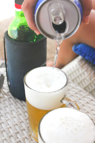 istock Young female pouring beer 690057032